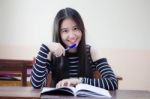 Portrait Of Thai Teen Beautiful Girl Writing Book Stock Photo