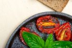 Baked Cherry Tomatoes With Basil And Thyme Stock Photo