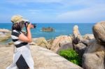 Woman Taking Photos At The Hin Ta Hin Yai Stock Photo