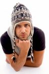 Male Lying And Wearing Woolen Cap Stock Photo