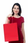 Pretty Woman With A Red Shopping Bag Stock Photo