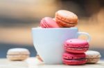 Macaron In Coffee Cup Stock Photo