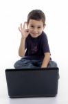 Boy With Laptop Showing Ok Gesture Stock Photo