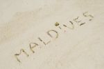 Maldives Written In A Sandy Tropical Beach Stock Photo