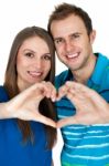 Couple Making Heart Gesture Of Love Stock Photo