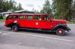 Red Bus In Glacier National Park Montana Stock Photo