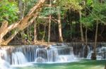 The Water Flowing Over Rocks And Trees Down A Waterfall At Huay Mae Khamin Waterfall National Park ,kanchana Buri In Thailand Stock Photo