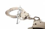 Handcuffs And Key Stock Photo