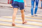 Young Woman Feet, Crossing An Urban Street Stock Photo