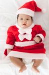 Little Girl With Santa Costume Stock Photo