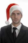 Close Up View Of Businessman In Santa Cap Stock Photo