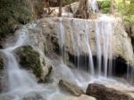 Waterfall With Water Flowing Around Stock Photo