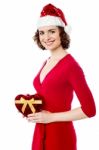 Smiling Santa With Christmas Gift Stock Photo