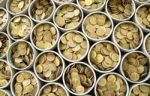 Many Coin Lined In Silver Bowl Stock Photo