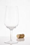 Empty Red Wine Glass And Wine Bottle Cork Stock Photo