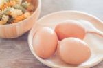 Fresh Eggs On Wooden Plate With Fusili Stock Photo