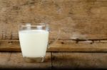 Glass With Milk On The Wooden Background Stock Photo