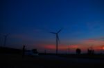 Wind Farm With The Silhouettes Stock Photo