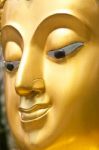 Golden Buddhist Statue Face Stock Photo