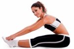 Young Woman In Fitness Outfit Stretching Stock Photo