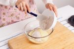 Woman Baking Healthy Muffin With Flour And Ground Flaxseed Stock Photo