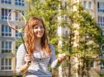 Young Beautiful Woman Playing Badminton Stock Photo