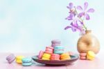 French Macarons On Pink Wooden Background. Vintage Style Stock Photo