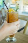 Hand On Iced Lemon Tea Stock Photo