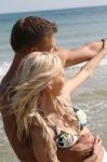 Young Couples At Beach Stock Photo