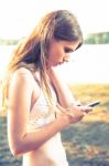 Girl With Smart Phone Near Beach Stock Photo