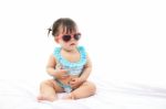 Portrait Baby Girl In Swimsuit On White Background Stock Photo