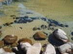 Rock In Clear Lake Water Stock Photo