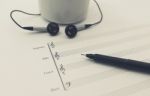 Music Sheet Earphone And Cup Stock Photo