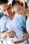 Young Couple Using A Digital Tablet Stock Photo