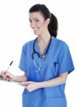 Smiling Cute Nurse Making Her Medical Notes Stock Photo