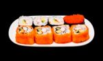 Sushi In White Plate On Black Background Stock Photo