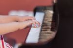 Girl Plays Piano Stock Photo