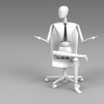 Businessman Doll Sitting On Chair Stock Photo