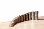 Columns Of Coins On The Table Stock Photo