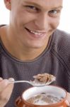 Smiling Man Eating Cornflakes Stock Photo