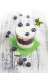 Glass Of Yogurt With Fresh Blueberries Stock Photo