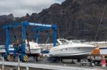 Boat Being Cleaned In Los Gigantes Marina Stock Photo