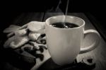 Coffee Cup And Tools On A Wooden Table. Dark Background Stock Photo