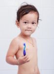 Baby And Toothbrush Stock Photo