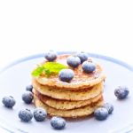 Pile Of Pancakes With Blueberries Sprinkled With Icing Sugar Stock Photo