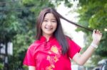 Portrait Of Thai Teen Beautiful Girl In Chinese Dress, Relax And Smile Stock Photo