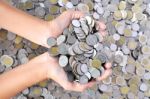 A Lot Of Coins In Hands Stock Photo