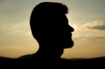 Silhouette Of A Man In The Sunset Stock Photo