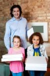 Father With His Daughters At Pizza Outlet Stock Photo