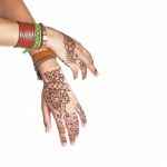 Mehendi Or Henna Tatoo On The Female Hands In Bracelets Isolated Stock Photo